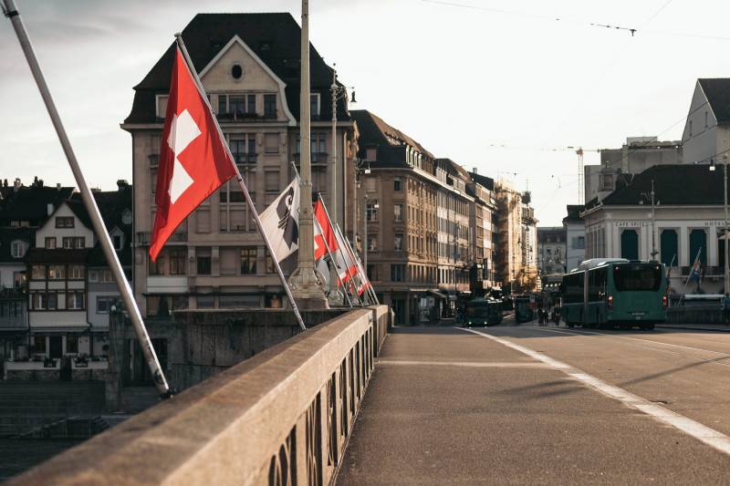 Bridge in Basel with Swiss flag